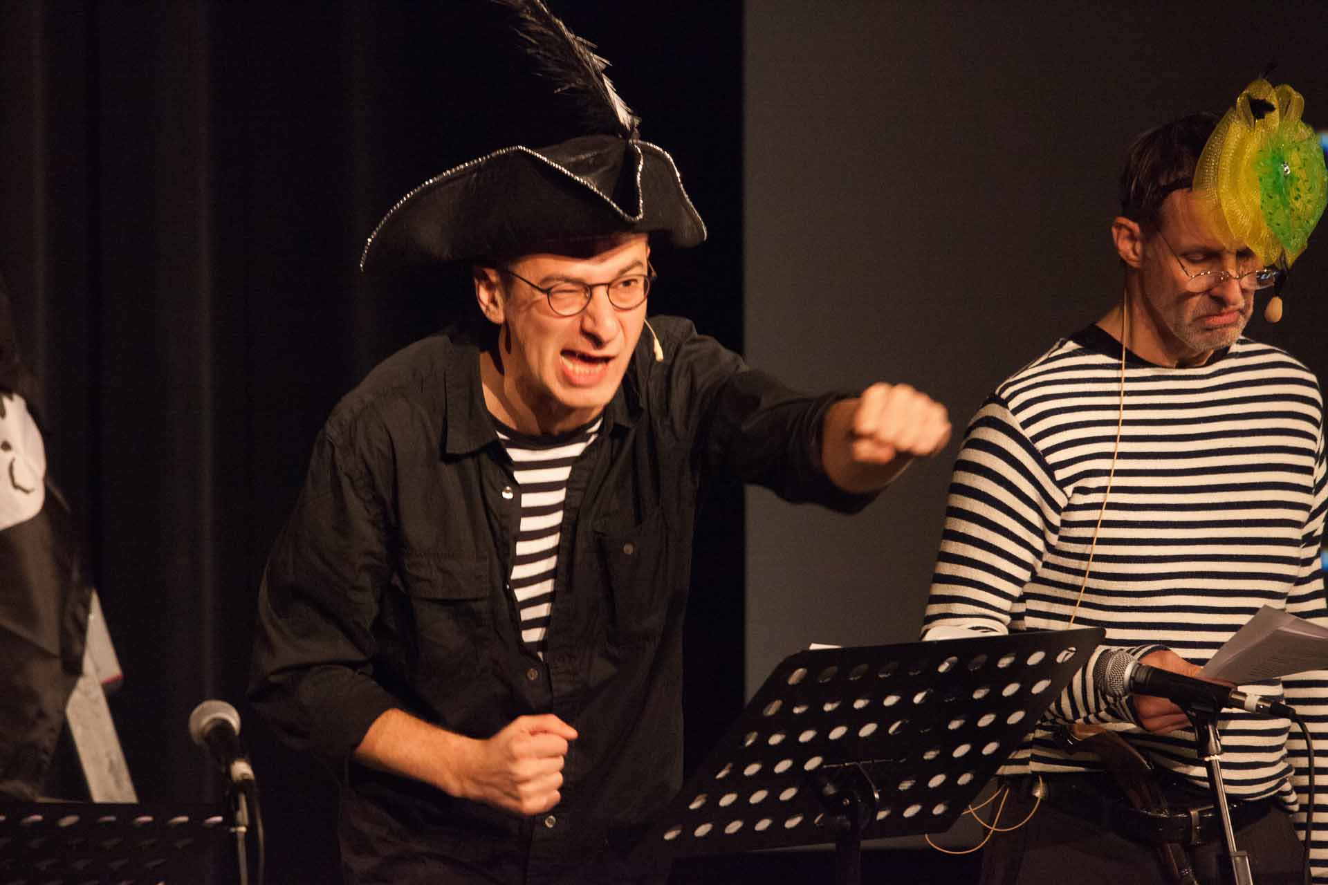 Zielinski.Photography - Images of artworks and culture - Berlin Two men dressed as pirates performing on stage with microphones.