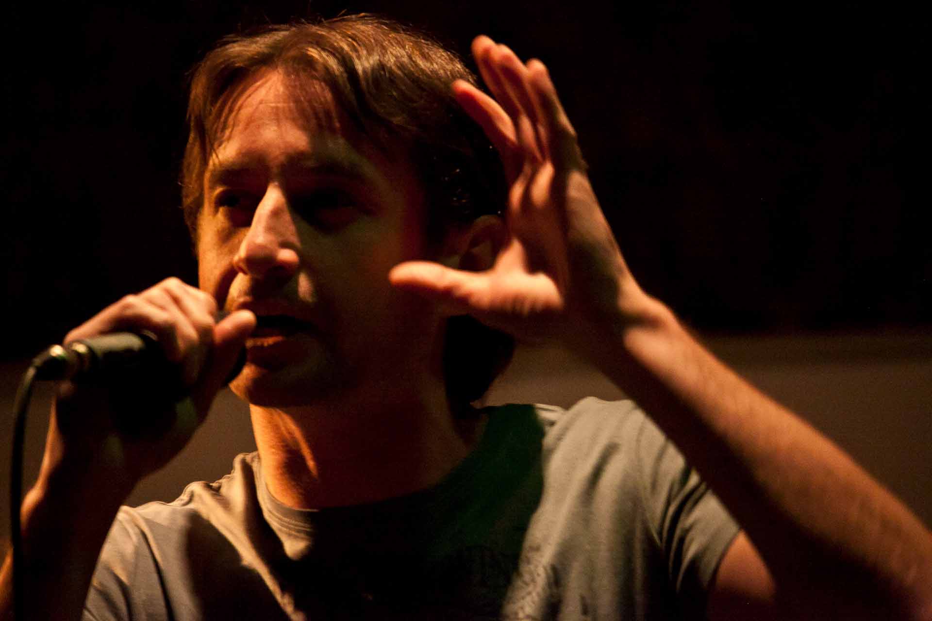 Zielinski.Photography - Images of artworks and culture - Berlin A man is performing music into a microphone.